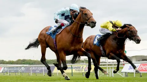 Getty Images Oisin Murphy riding Starman (L, light blue) win The Duke Of York Clipper Logistics Stakes at York Racecourse on May 12, 2021 in York, England.