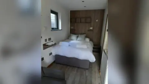 A bed inside the unit