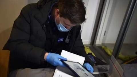 TVP Police officer with evidence