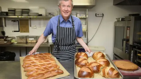 John Linton Willie Rennie poses with bread.
