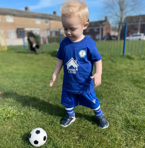 Family photo Harry Jackson in a Potton United Football Club kit