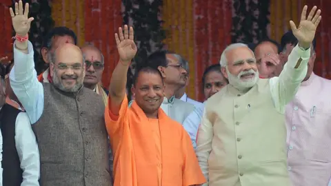 AFP Amit Shah (L), Yogi Adityanath (centre) and prime minister Narendra Modi