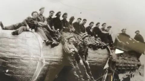 Cliff Dalton Mr Dalton, fifth from right, sits on a captured V2 rocket in wartime Germany