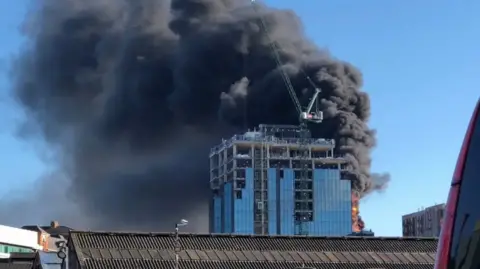 A picture of a fire in a high-rise building under construction in Reading.