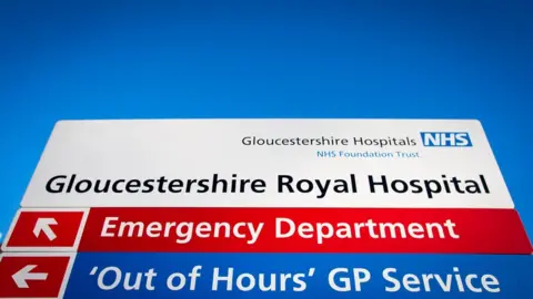 Getty Images A sign outside the Gloucestershire Royal Hospital showing the way to different departments