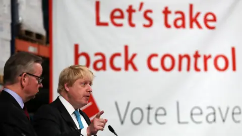 Getty Images Boris Johnson (right) and Michael Gove address workers during a Vote Leave campaign visit in June 2016