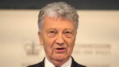 PA Media File photo of Sir William Shawcross looking ahead