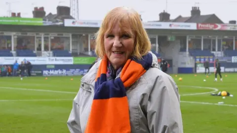 Luton Town Football Club Linda Strapp on the Luton Town pitch.