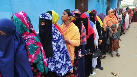 Getty Images Women queue for covid vaccines in Sylhet, Bangladesh