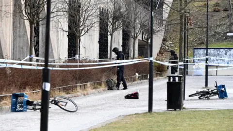 Getty Images The police has cordoned off and investigates the area outside Varby Gard metro station south of Stockholm