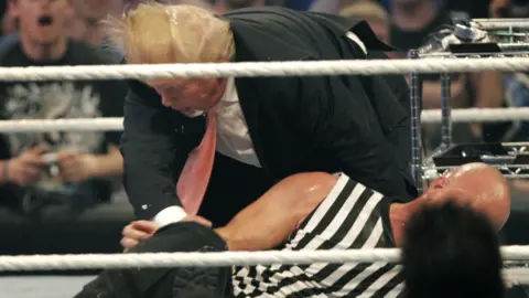 Getty Images Donald Trump gets taken to the mat by 'Stone Cold' Steve Austin after the the Battle of the Billionaires at the 2007 World Wrestling Entertainment's Wrestlemania April 1, 2007 at Ford Field in Detroit, Michigan.