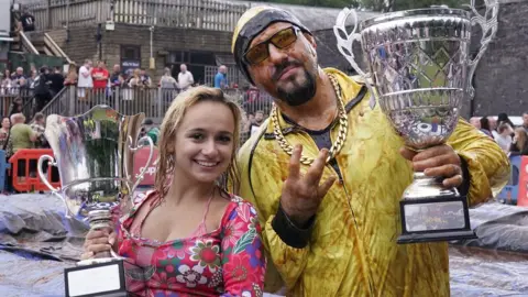 PA Media Imogen Young and Lloyd Clarkson