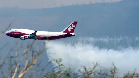AFP View of a Supertanker, an aerial firefighting airtanker, overflying the fires raging near Robore, Santa Cruz region, eastern Bolivia on August 23, 2019.
