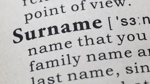 Getty Images The word surname as seen in a dictionary