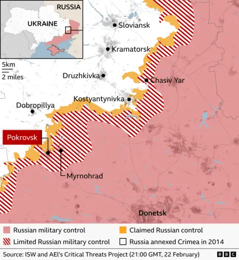 Map showing territorial control in eastern Ukraine near the city of Donetsk as of 18 February. Areas under Russian military control are shaded red including the city of Donetsk, limited control areas have red stripes, and claimed Russian control areas are shaded yellow. It shows that Russia has limited control of the south of Pokrovsk and claimed control of northern areas of the town. It also shows Russia has limited military control over the town of Chasiv Yar about 40km further east. Source: ISW