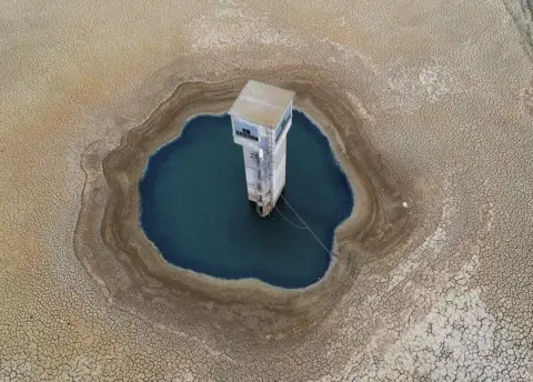 Reuters A general view shows the dry ground of the Chiba dam in the Nabeul Governorate, as the country battles with a drought, Nabeul, Tunisia April 1, 2023