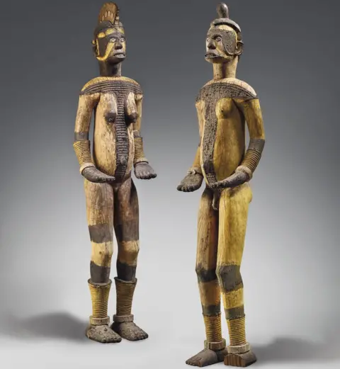 ©Christie’s Images Ltd, 2020 The wooden objects, one male and one female, represent deities from the Igbo community