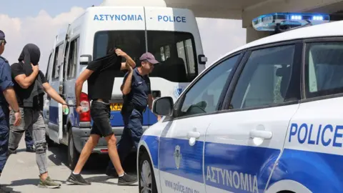 EPA Twelve male Israeli tourists appear before Famagusta District Court in Paralimni, Cyprus