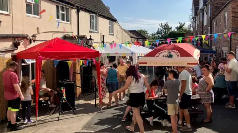 Phil Bodmer / BBC Fundraiser outside the Black Swan in Ripon