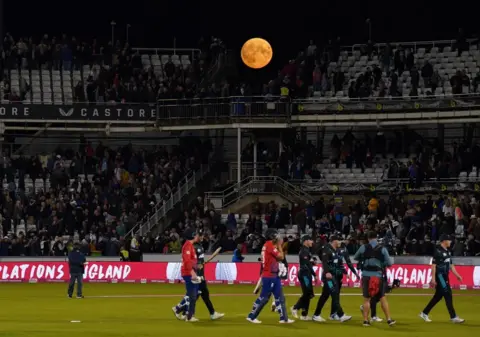 Owen Humphreys/PA Media The supermoon came into view over the stands during the first Vitality IT20 match at the Seat Unique Riverside in County Durham