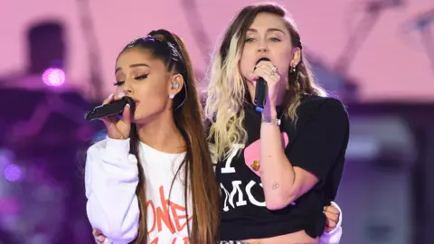 One Love Manchester/Dave Hogan Ariana Grande (left) performed with Miley Cyrus