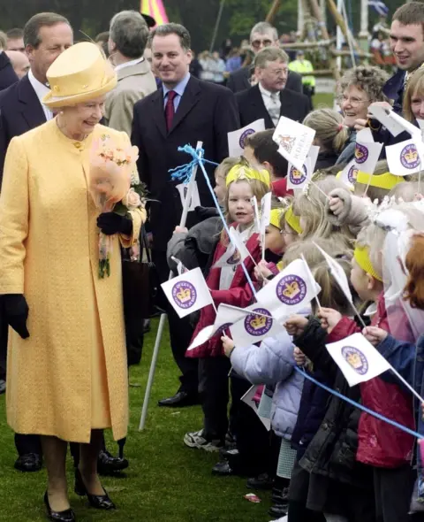 Getty Images Queen Elizabeth Is Greeted By School Children With Scotland's First Minister Jack McConnell (centre Left) Looking On At Duthie Park, Aberdeen.