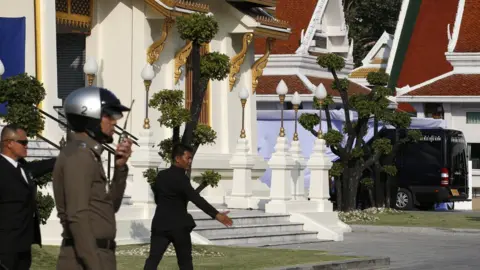 EPA The Leicester City chairman's hearse arriving for funeral rites at Wat Debsirindrawas Ratchaworawiharn Temple in Bangkok, Thailand