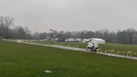 Peter Aitken Production equipment is being set up on the flood plain next to the River Ver