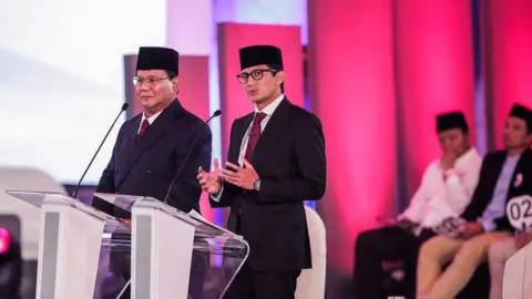 Getty Images Presidential candidate Prabowo Subianto (L) and his running mate Sandiaga Uno (R)