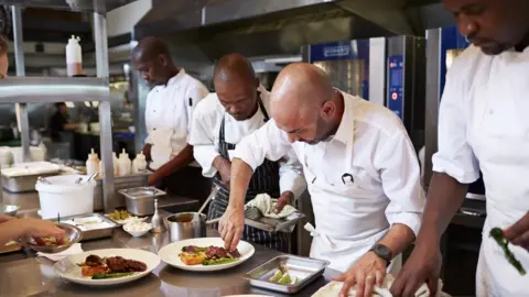 Getty Images Chefs at work in kitchen