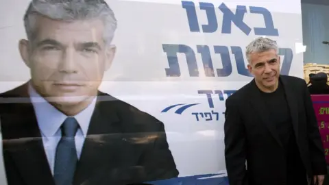 AFP Yair Lapid, leader of the Yesh Atid party, visits a polling station in the Israeli coastal city of Netanya on 22 January 2013