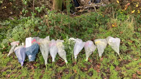 Floral tributes left at the site