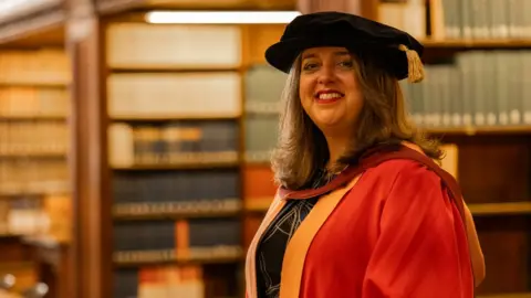 University of Bristol Alex Ardalan-Raikes MBE in graduation robe