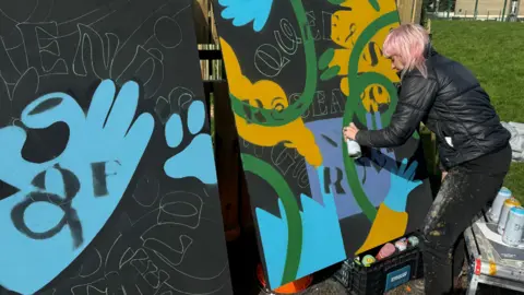 BBC Artist Zippy with murals