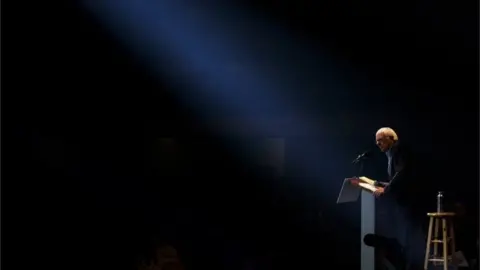 Getty Images Democratic presidential candidate Sen. Bernie Sanders in a spotlight