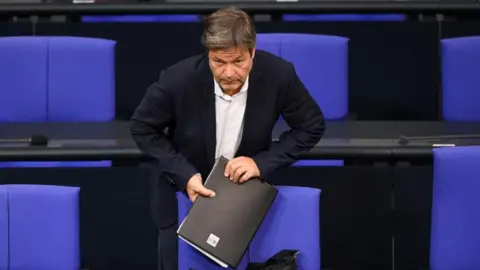 Reuters German Economy and Climate Minister Robert Habeck looks on, on the day of a plenum session of the lower house of parliament Bundestag in Berlin, Germany, October 19, 2023.