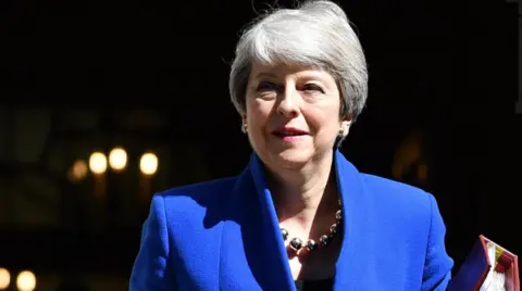 Getty Images Theresa May dressed in blue