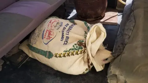 Hisham al-Hoot Nelson inside a bag