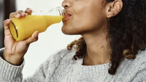 Getty Images Drinking OJ