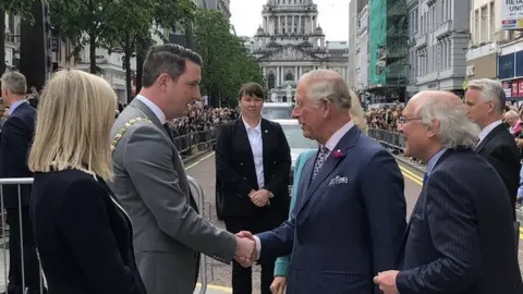 BBC Prince Charles is greeted by the new Sinn Féin Lord Mayor of Belfast, John Finucane