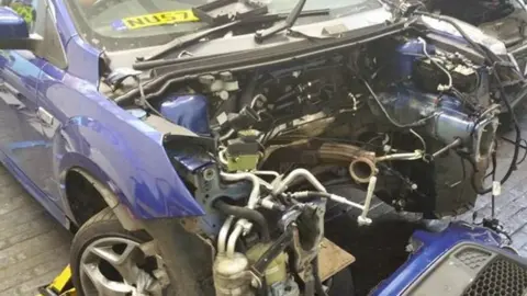 West Midlands Police A car stripped of parts