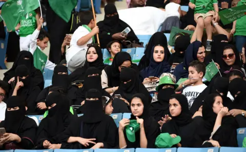 AFP/Getty Images Saudi women sit in a stadium to attend an event in the capital Riyadh on 23 September 2017 commemorating the anniversary of the founding of the kingdom