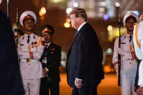 Getty Images Trump arrives in Vietnam