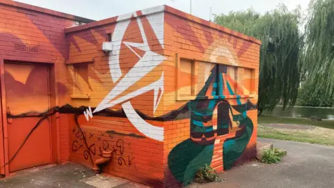 Nadia Gyane/BBC A painted former toilet block