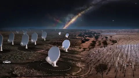 SKAO A dark, starry desert landscape filled with huge white radio dishes, each like a shallow bowl on a tall pedestal, all tilted toward the sky. In the foreground, stand many spiky metal antenna frames. The Milky Way arches overhead, giving a sense of a vast, silent observatory listening to space.