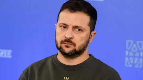 Getty Images Zelensky seen at a press conference in Kyiv last month