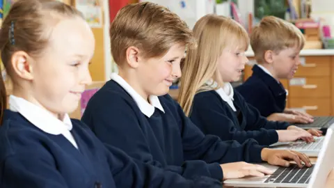 Highwaystarz/Getty Images Children in school