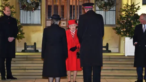 PA Media The Queen speaks to Salvation Army representatives