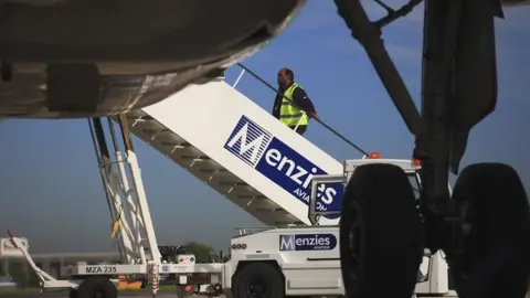 John Menzies Menzies Aviation staff at airport