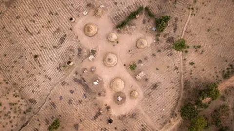 Getty Images Aerial view of a Fulani village in Kachia Grazing Reserve, Kaduna State, Nigeria, on April 18, 2019. Kachia Grazing Reserve is an area set aside for the use of Fulani pastoralist and it is intended to be the foci of livestock development